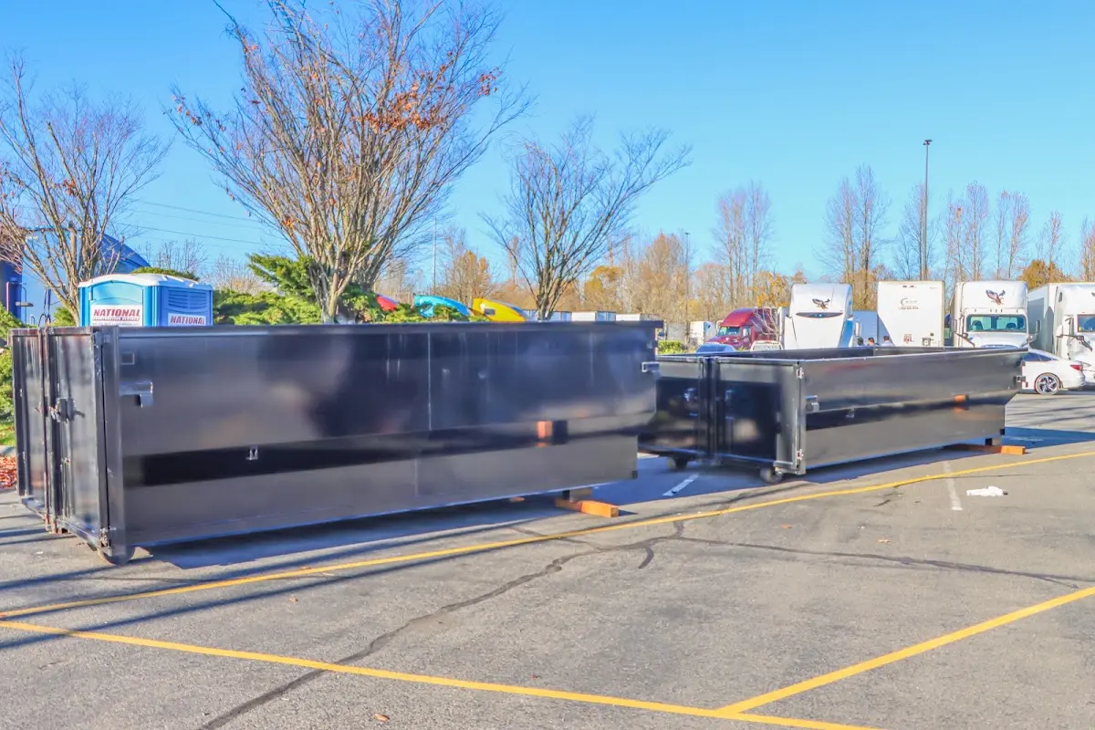 Professional dumpster rental service with roll-off container on residential driveway in Litchfield Beach